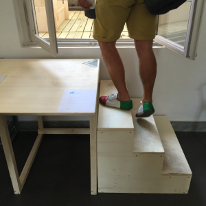 Great confidence in the durability of Open Desk's furniture (also used as makeshift stairs)